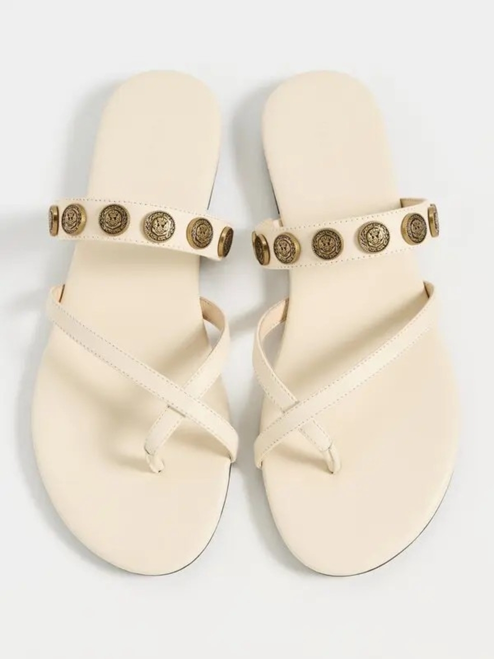 L'AGENCE Cream Slide Sandals with Gold Medallion Accents